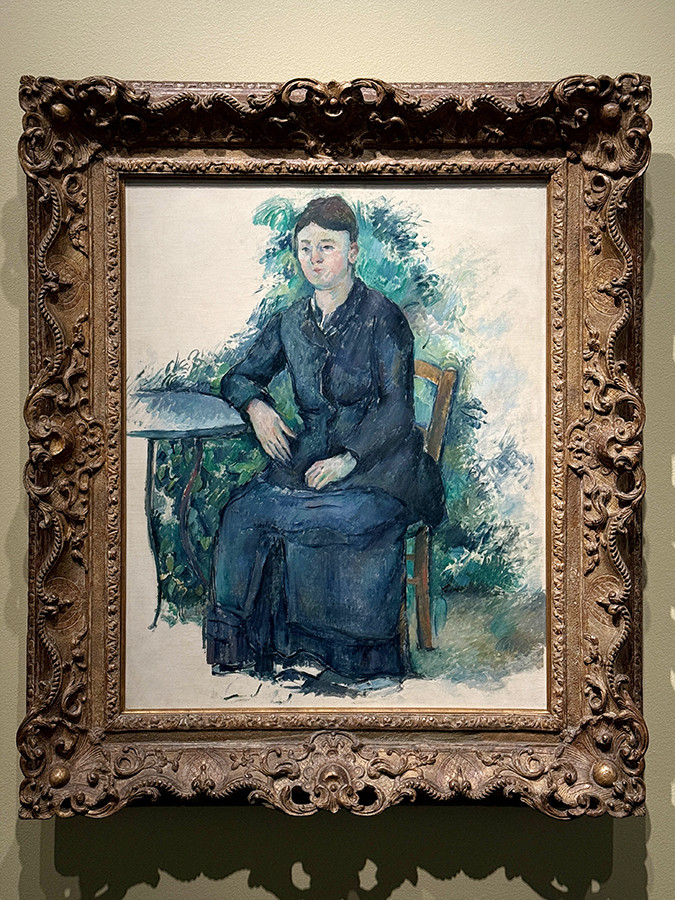 三菱一号館美術館「ルノワール×セザンヌ ―モダンを拓いた2人の巨匠」会場より　ポール・セザンヌ《庭のセザンヌ夫人》1880年頃　オランジュリー美術館