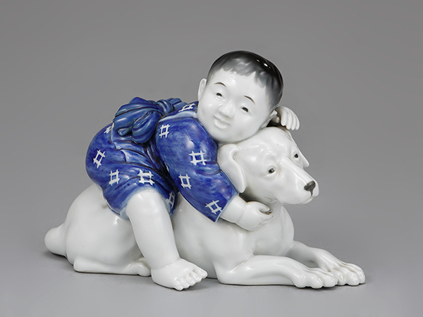 《少年と犬置物》